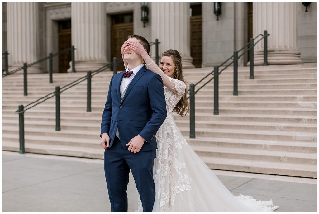 Bride covers groom's eyes at their first look