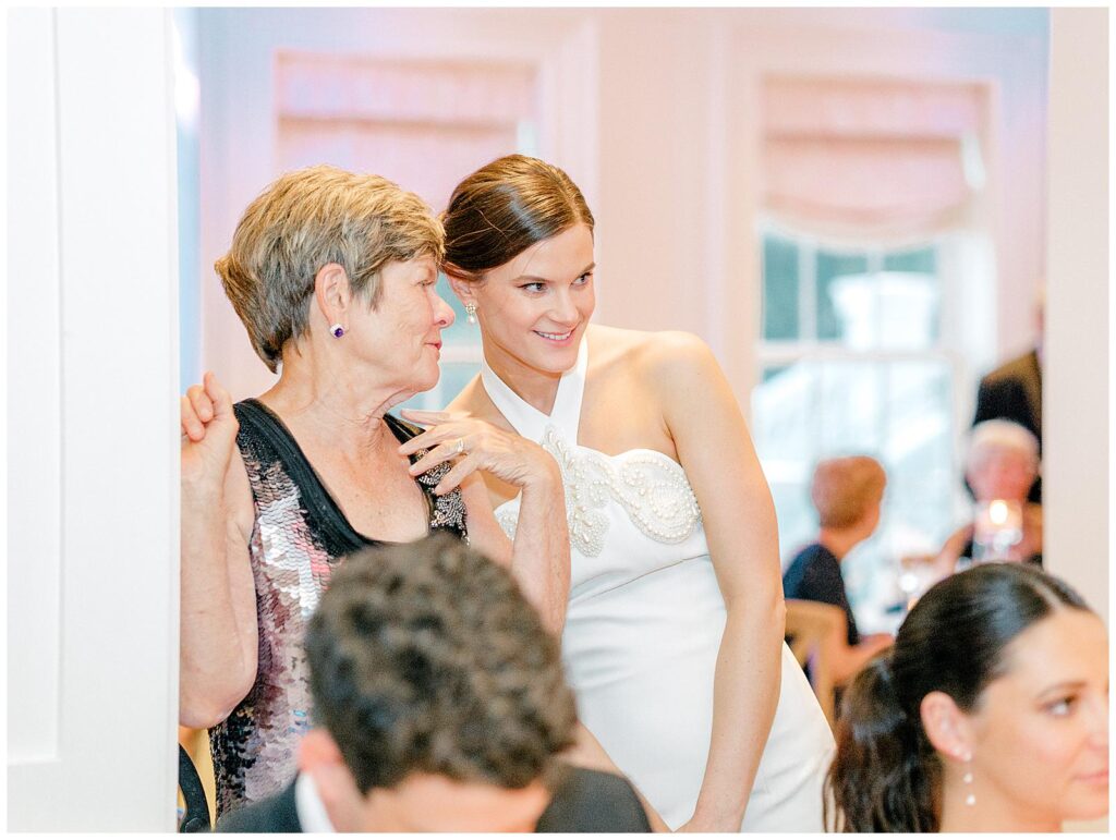 Bride watches mother-son dance at wedding reception