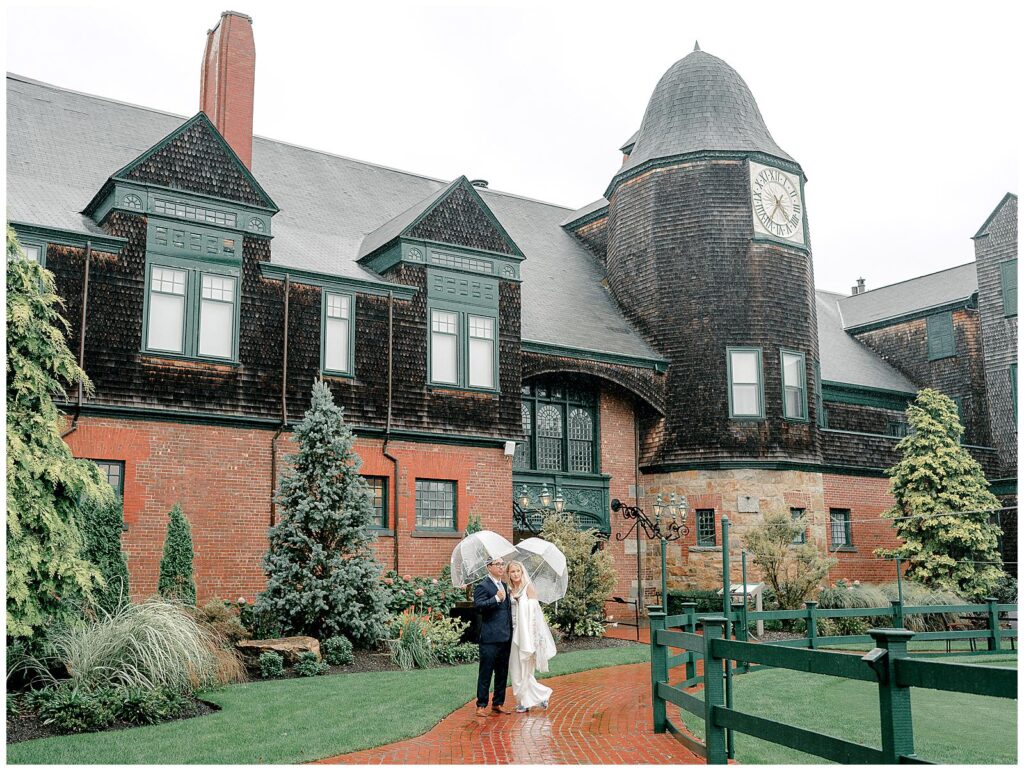 Bride and groom photos outside in the rain at International Tennis Hall of Fame in Newport, RI