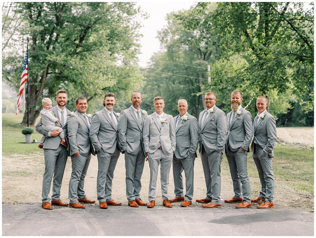 Groom and his groomsmen pose for a portrait