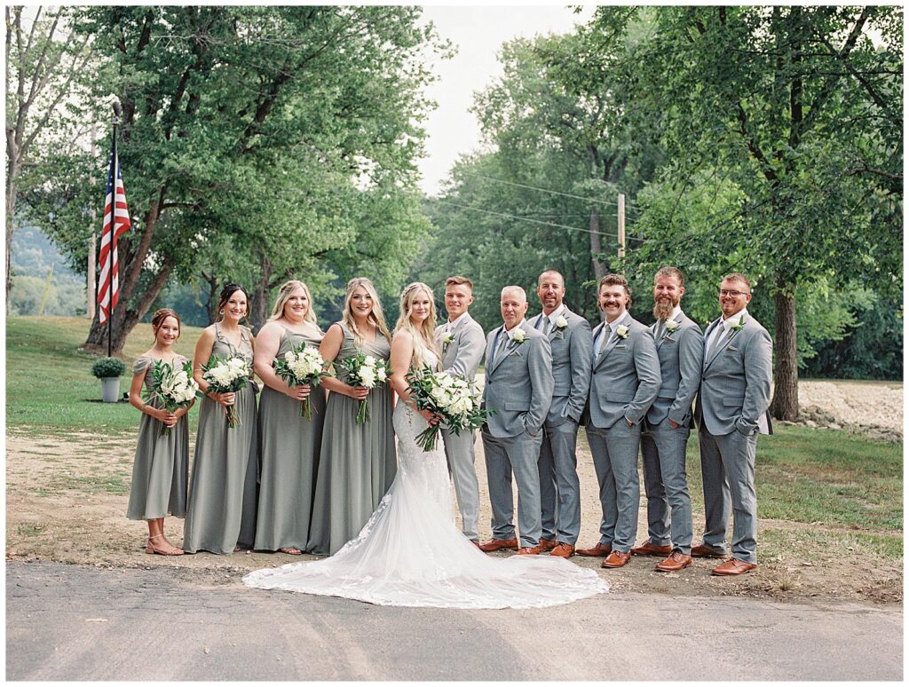 Full wedding party in their green and gray wedding attire