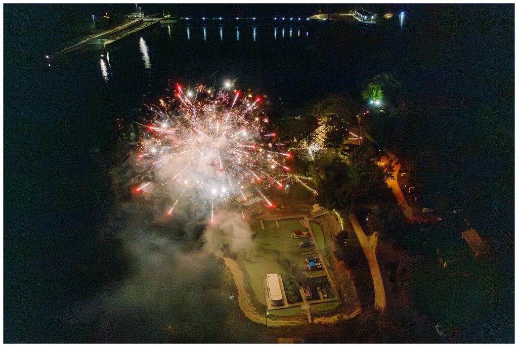 Drone shot of the fireworks show at a tented Wisconsin wedding.