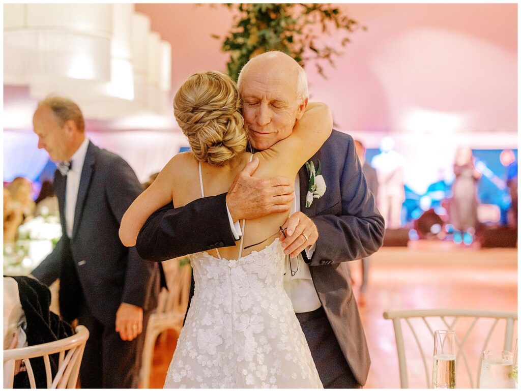 The bride hugs her dad at her Chatham Bars Inn wedding reception.
