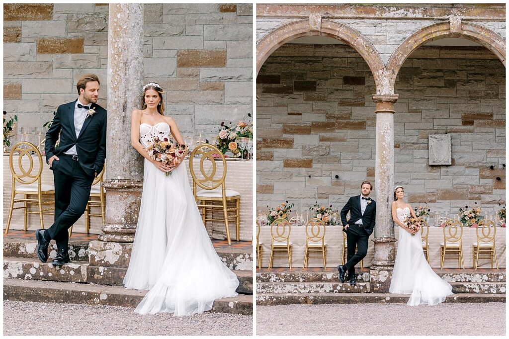 Bride and groom pose in front of their Ireland castle wedding reception table