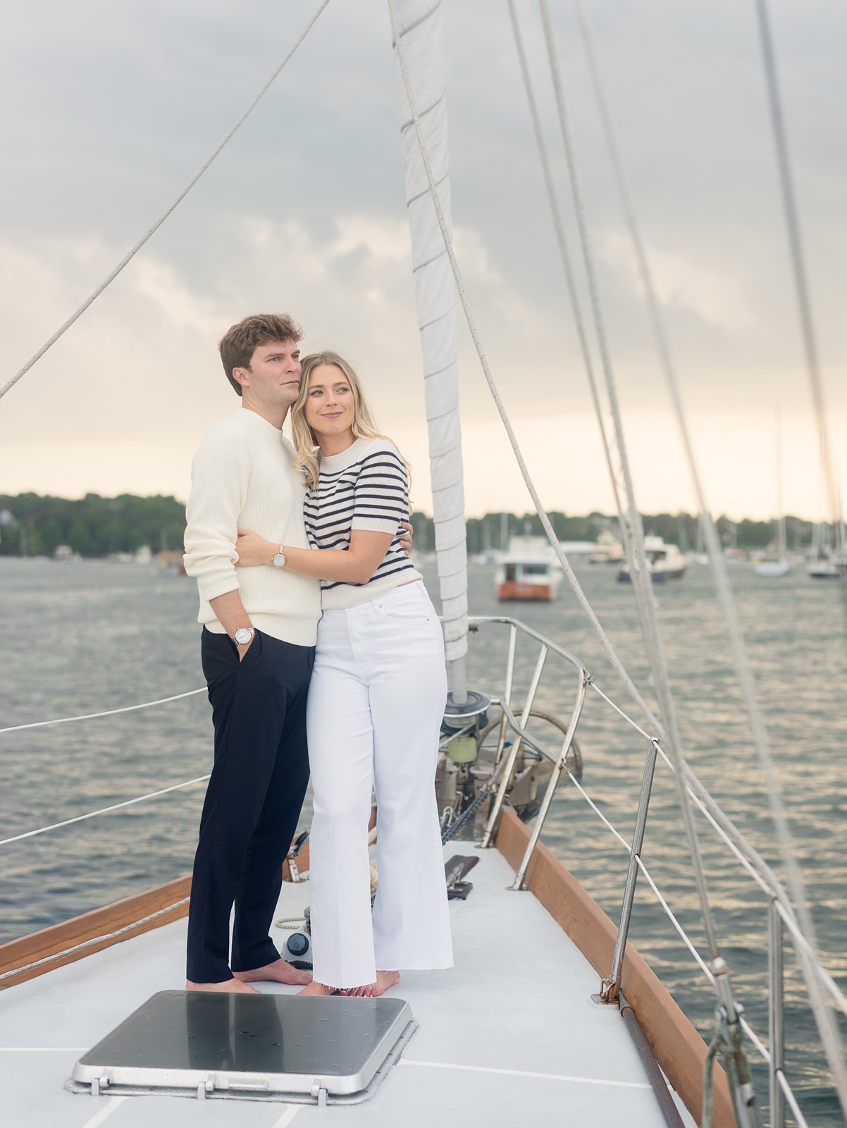 Couple on a sailboat during their Newport engagement photos