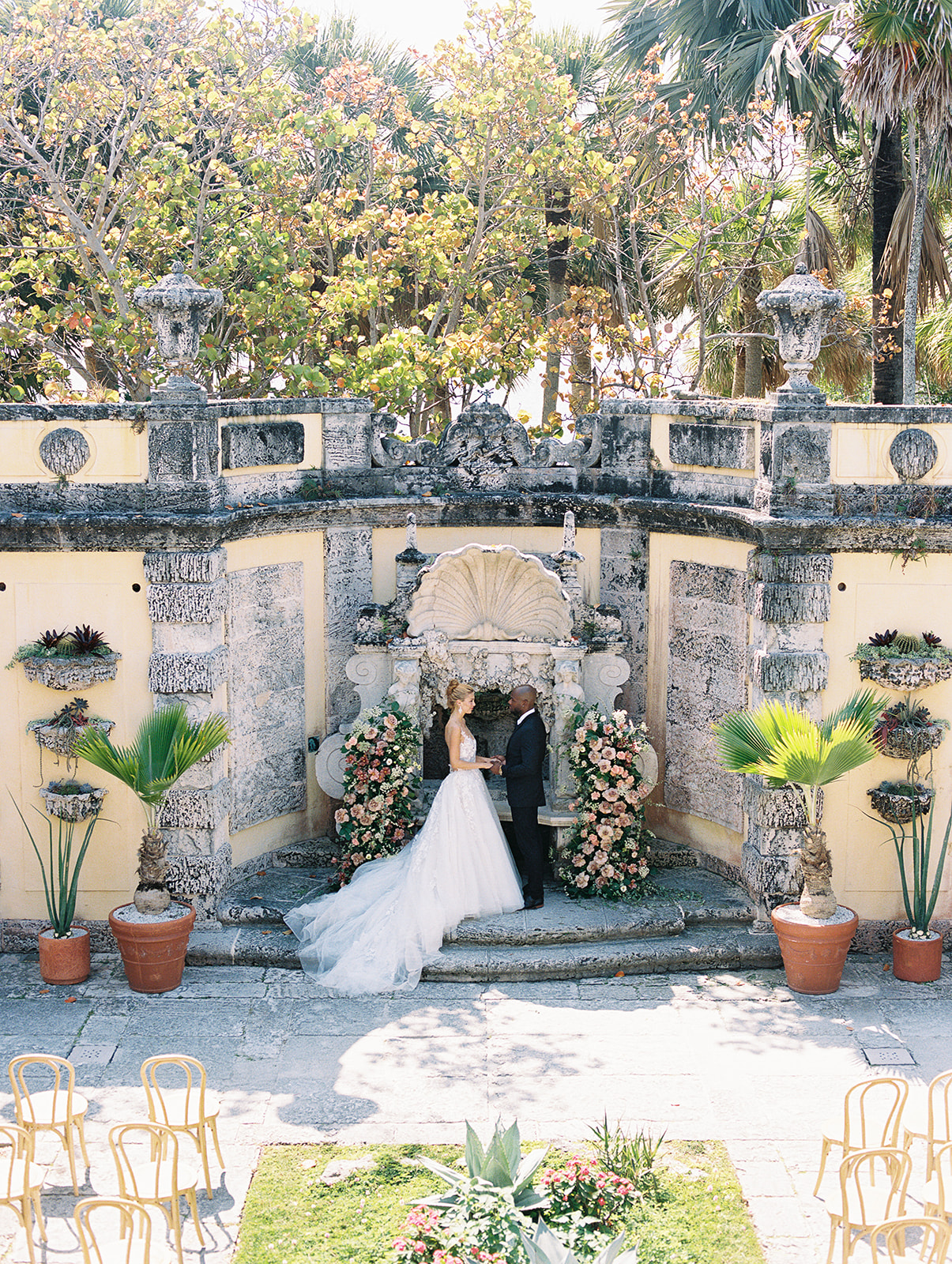 Bride and groom say vows at Vizcaya Museum and Gardens wedding ceremony